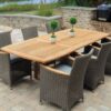 outdoor teak dining table with black rattan chair