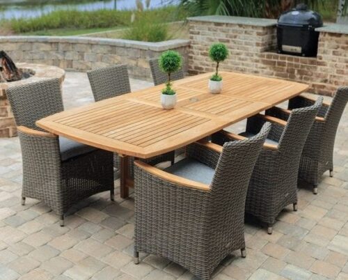 outdoor teak dining table with black rattan chair